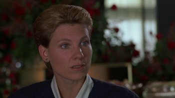 Movie still from “House of Games” (1987), directed by David Mamet – A person with short hair; Close Up shot, Over the shoulder angle