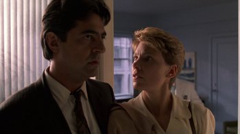 Movie still from “House of Games” (1987), directed by David Mamet – A man and a woman standing next to each other; Close Up shot, Low angle
