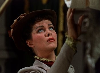Movie still from “House of Wax” (1953), directed by André De Toth – A person wearing a hat; Close Up shot, Low angle