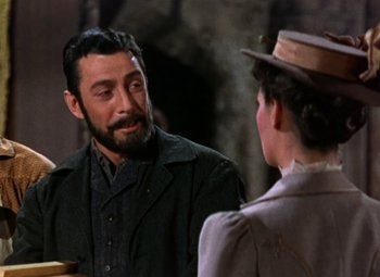 Movie still from “House of Wax” (1953), directed by André De Toth – A man and a woman talking to each other; Medium shot, Over the shoulder angle