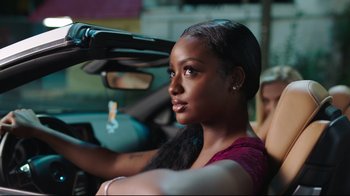Movie still from “How High 2” (2019), directed by Bruce Leddy – A woman sitting in the driver's seat of a car; Close Up shot, Over the shoulder angle