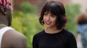 Movie still from “How High 2” (2019), directed by Bruce Leddy – A person wearing a black shirt; Close Up shot, Over the shoulder angle