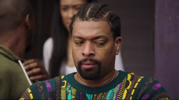 Movie still from “How High 2” (2019), directed by Bruce Leddy – A person wearing a sweater; Close Up shot, Over the shoulder angle