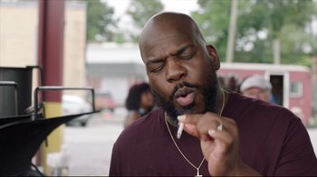 Movie still from “How High 2” (2019), directed by Bruce Leddy – A man with a beard is smoking a cigarette; Close Up shot, Low angle