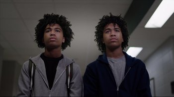 Movie still from “How High 2” (2019), directed by Bruce Leddy – Two young men standing next to each other in a room; Close Up shot, Low angle