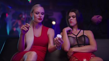 Movie still from “How High 2” (2019), directed by Bruce Leddy – Two beautiful women sitting on a bench in a room; Medium shot, Low angle