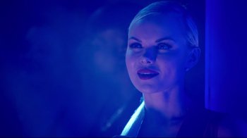 Movie still from “How High 2” (2019), directed by Bruce Leddy – A beautiful woman with blonde hair in a dark room; Close Up shot, Over the shoulder angle