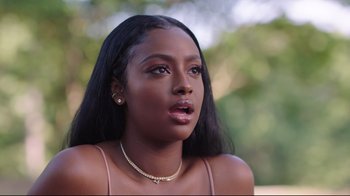 Movie still from “How High 2” (2019), directed by Bruce Leddy – A beautiful young woman with long black hair; Close Up shot, Over the shoulder angle