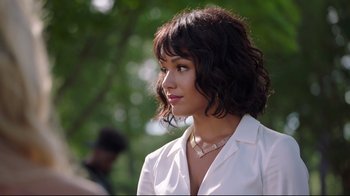 Movie still from “How High 2” (2019), directed by Bruce Leddy – A beautiful young woman with a short black hair wearing a white shirt; Close Up shot, Over the shoulder angle