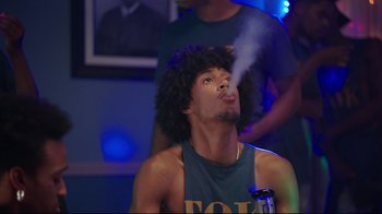 Movie still from “How High 2” (2019), directed by Bruce Leddy – A young man smoking a cigarette in front of a crowd; Medium shot, Low angle