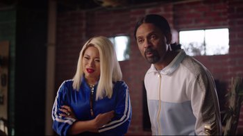 Movie still from “How High 2” (2019), directed by Bruce Leddy – A man and a woman standing next to each other; Medium shot, Over the shoulder angle