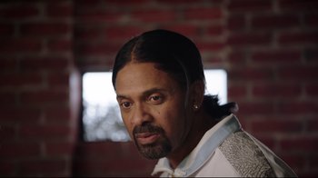 Movie still from “How High 2” (2019), directed by Bruce Leddy – A person with a long black hair; Close Up shot, Low angle