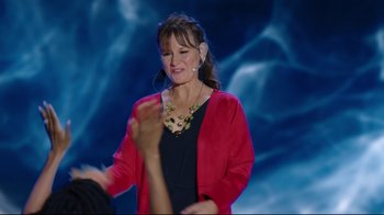 Movie still from “How High 2” (2019), directed by Bruce Leddy – A woman in a black shirt and a red jacket; Medium shot, Over the shoulder angle