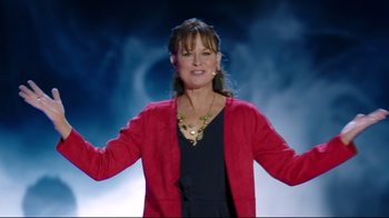 Movie still from “How High 2” (2019), directed by Bruce Leddy – A woman wearing a red jacket and a black dress; Medium shot, Low angle