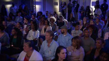 Movie still from “How High 2” (2019), directed by Bruce Leddy – A group of people sitting in a room with microphones; Wide shot, High angle