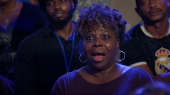 Movie still from “How High 2” (2019), directed by Bruce Leddy – A woman with a surprised look standing next to a man; Close Up shot, Over the shoulder angle