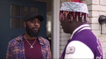 Movie still from “How High 2” (2019), directed by Bruce Leddy – Two men standing next to each other in front of a house; Medium shot, Over the shoulder angle