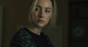 Movie still from “How I Live Now” (2013), directed by Kevin Macdonald – A person wearing a black shirt; Close Up shot, High angle