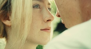 Movie still from “How I Live Now” (2013), directed by Kevin Macdonald – A woman's face and a man's face; Extreme Close Up shot, Over the shoulder angle