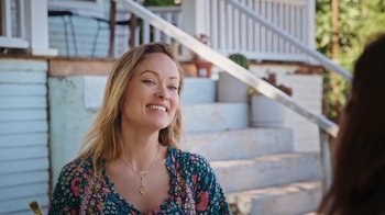 Movie still from “How It Ends” (2021), directed by Daryl Wein – A woman with blonde hair wearing a floral shirt; Close Up shot, High angle