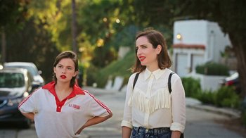 Movie still from “How It Ends” (2021), directed by Daryl Wein – A woman standing next to a young girl on a street; Medium shot, High angle