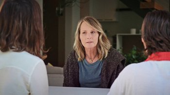 Movie still from “How It Ends” (2021), directed by Daryl Wein – A woman sitting in front of another woman in front of a mirror; Close Up shot, Over the shoulder angle