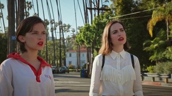 Movie still from “How It Ends” (2021), directed by Daryl Wein – Two women are walking down the street together; Medium shot, Low angle
