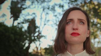 Movie still from “How It Ends” (2021), directed by Daryl Wein – A person looking up at the sky; Close Up shot, Low angle