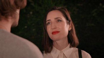 Movie still from “How It Ends” (2021), directed by Daryl Wein – A person wearing a white shirt; Close Up shot, Over the shoulder angle