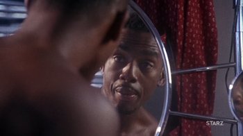 Movie still from “How to Be a Player” (1997), directed by Lionel C. Martin – A person in a mirror looking in a mirror; Close Up shot, Over the shoulder angle