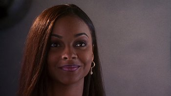 Movie still from “How to Be a Player” (1997), directed by Lionel C. Martin – A person with long brown hair; Close Up shot, High angle