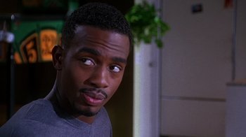 Movie still from “How to Be a Player” (1997), directed by Lionel C. Martin – A person looking at the camera; Close Up shot, Over the shoulder angle