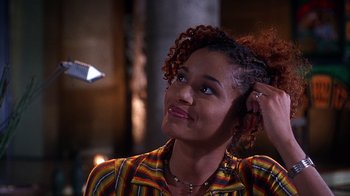 Movie still from “How to Be a Player” (1997), directed by Lionel C. Martin – A woman with curly red hair is looking up; Close Up shot, Over the shoulder angle