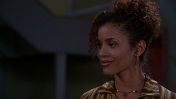 Movie still from “How to Be a Player” (1997), directed by Lionel C. Martin – A person with curly hair; Close Up shot, Over the shoulder angle