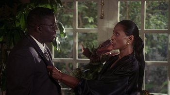 Movie still from “How to Be a Player” (1997), directed by Lionel C. Martin – A man and a woman in front of a window; Medium shot, Over the shoulder angle