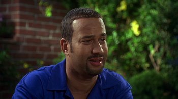 Movie still from “How to Be a Player” (1997), directed by Lionel C. Martin – A person wearing a blue shirt; Close Up shot, High angle