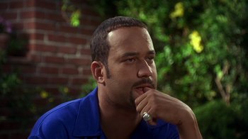 Movie still from “How to Be a Player” (1997), directed by Lionel C. Martin – A person with his hand under his chin; Close Up shot, High angle