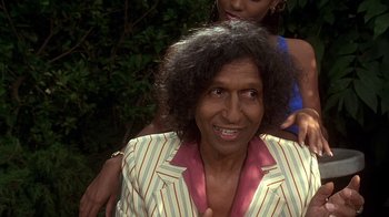 Movie still from “How to Be a Player” (1997), directed by Lionel C. Martin – An older woman is smiling for the camera while a younger woman looks on; Close Up shot, High angle