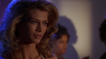 Movie still from “How to Be a Player” (1997), directed by Lionel C. Martin – A person with long blonde hair; Close Up shot, Low angle