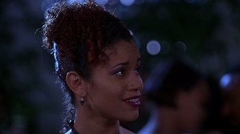 Movie still from “How to Be a Player” (1997), directed by Lionel C. Martin – A person wearing a dress; Close Up shot, Over the shoulder angle