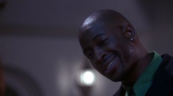 Movie still from “How to Be a Player” (1997), directed by Lionel C. Martin – A person smiling; Close Up shot, Low angle