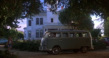 Movie still from “How to Make an American Quilt” (1995), directed by Jocelyn Moorhouse – An old van parked in front of a house; Wide shot, Low angle