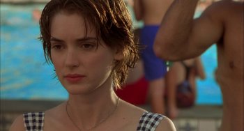 Movie still from “How to Make an American Quilt” (1995), directed by Jocelyn Moorhouse – A person wearing a necklace near a body of water; Close Up shot, Over the shoulder angle