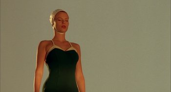 Movie still from “How to Make an American Quilt” (1995), directed by Jocelyn Moorhouse – A woman in a bathing suit and head covering; Medium shot, Low angle