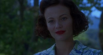 Movie still from “How to Make an American Quilt” (1995), directed by Jocelyn Moorhouse – A beautiful woman with red lipstick wearing a floral shirt; Close Up shot, Over the shoulder angle