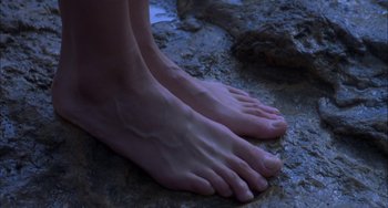 Movie still from “How to Make an American Quilt” (1995), directed by Jocelyn Moorhouse – A pair of bare feet on the ground; Extreme Close Up shot, High angle