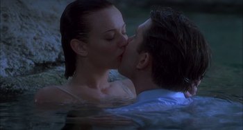 Movie still from “How to Make an American Quilt” (1995), directed by Jocelyn Moorhouse – A man and a woman kissing in a pool of water; Close Up shot, High angle