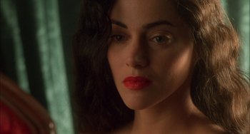 Movie still from “How to Make an American Quilt” (1995), directed by Jocelyn Moorhouse – A woman with red lipstick looking into a mirror; Close Up shot, High angle