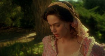 Movie still from “How to Make an American Quilt” (1995), directed by Jocelyn Moorhouse – A woman with a pink and yellow scarf around her head; Close Up shot, Over the shoulder angle