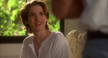 Movie still from “How to Make an American Quilt” (1995), directed by Jocelyn Moorhouse – A person sitting in a chair; Close Up shot, Over the shoulder angle